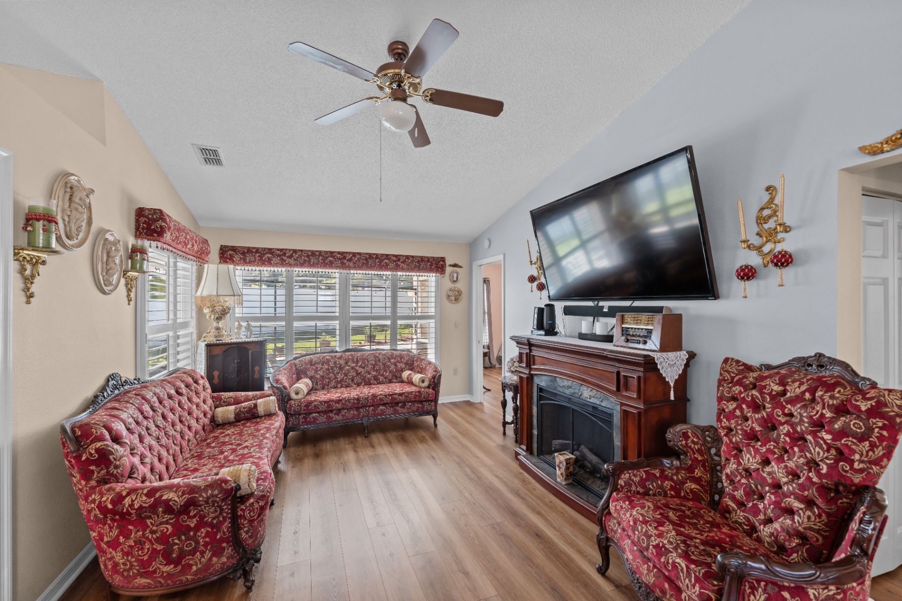 Living room with fireplace and vaulted ceiling