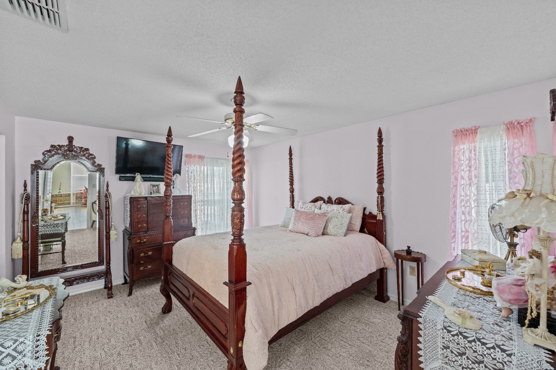 In-law suite bedroom with four-poster bed
